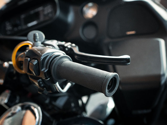 A close up of a motorcycle handlebar with Bear Grips - 1" TBW Motorcycle Grips By: @cbearstunts and Speedwell throttle by wire.