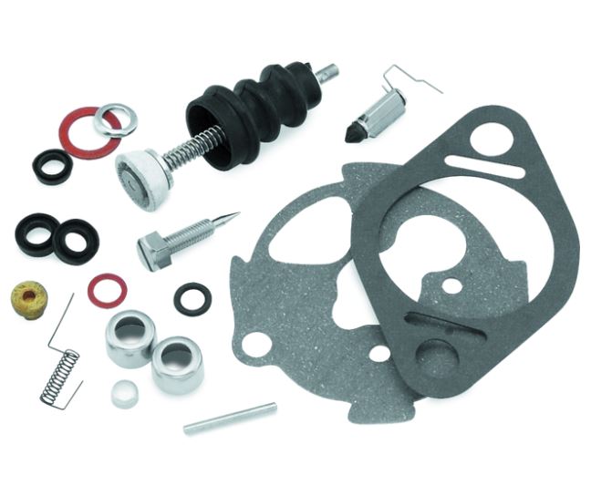 Various small engine parts and components, such as gaskets, screws, a spring, rubber rings, and a bolt from the Twin Power Bendix Rebuild Kit by Twin Power are arranged on a white background. This kit is perfect for vintage Harley enthusiasts or anyone using the Twin Power Bendix Rebuild Kit.