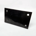 A Yamaha motorcycle engine is securely mounted on a Chop Source Deluxe Yamaha XS650 Engine Stand Brackets by Chop Source, positioned against a plain white wall.