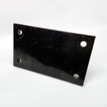 A Yamaha motorcycle engine is securely mounted on a Chop Source Deluxe Yamaha XS650 Engine Stand Brackets by Chop Source, positioned against a plain white wall.