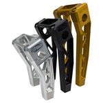 Three TC Bros. Pro Series Truss Digital Gauge Pullback Risers for Harley-Davidson Softail (2018-2024) in gold, black, and silver are upright against a white background, showcasing their durable style.