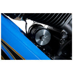 A PC Racing Reusable Oil Filter for 1984-Up Harley-Davidson Big Twin, featuring a metal construction with vertical slats, is displayed alongside a black cylindrical oil filter housing labeled with an arrow and the word "FLOW.