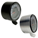 Two cylindrical motorcycle tachometer bezels from TC Bros., including the Pro Series 4 inch Gauge Relocation Bezel for Harley Davidson, in black and silver finishes with similar gauge faces featuring numbers and a red needle.