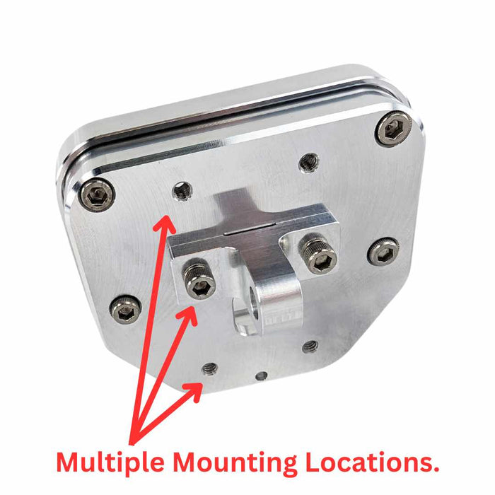 A TC Bros. Pro Series Digital Gauge Relocation Bezel 2018-up Harley Softail, likely aluminum, with reflective surfaces and milled contours.