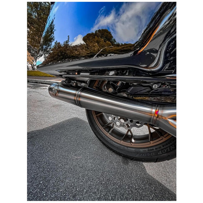 A close up of a SP Concepts M8 Bagger stainless full-length exhaust pipe.