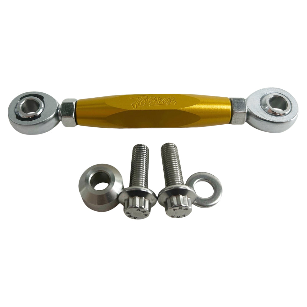 The TC Bros. M8 Softail Adjustable Brake Linkage for Mid Controls includes three adjustable rod end bearings in black, gold, and silver, each with engraved branding. Ideal for Harley Davidson M8 Softail mid controls, the set comprises two bolts, two lock nuts, and two washers for precise adjustments.