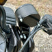 Two black metal mounting brackets for the TC Bros. Gauge Relocation Bracket for 2022-Up Harley-Davidson Nightster, shown with screws, washers, and nuts on a white background.