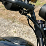 A TC Bros. Brake Line Extension for 2022-Up Harley-Davidson Nightster is coiled in a circle with four copper washers on a white background.