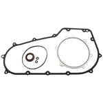 The Moto Iron® Twin Cam Primary Cover Gasket Kit for 2006-2017 Harley-Davidson Dyna and Softail includes a large gasket, round gasket, small circular seal, and O-rings, all shown on a white background.