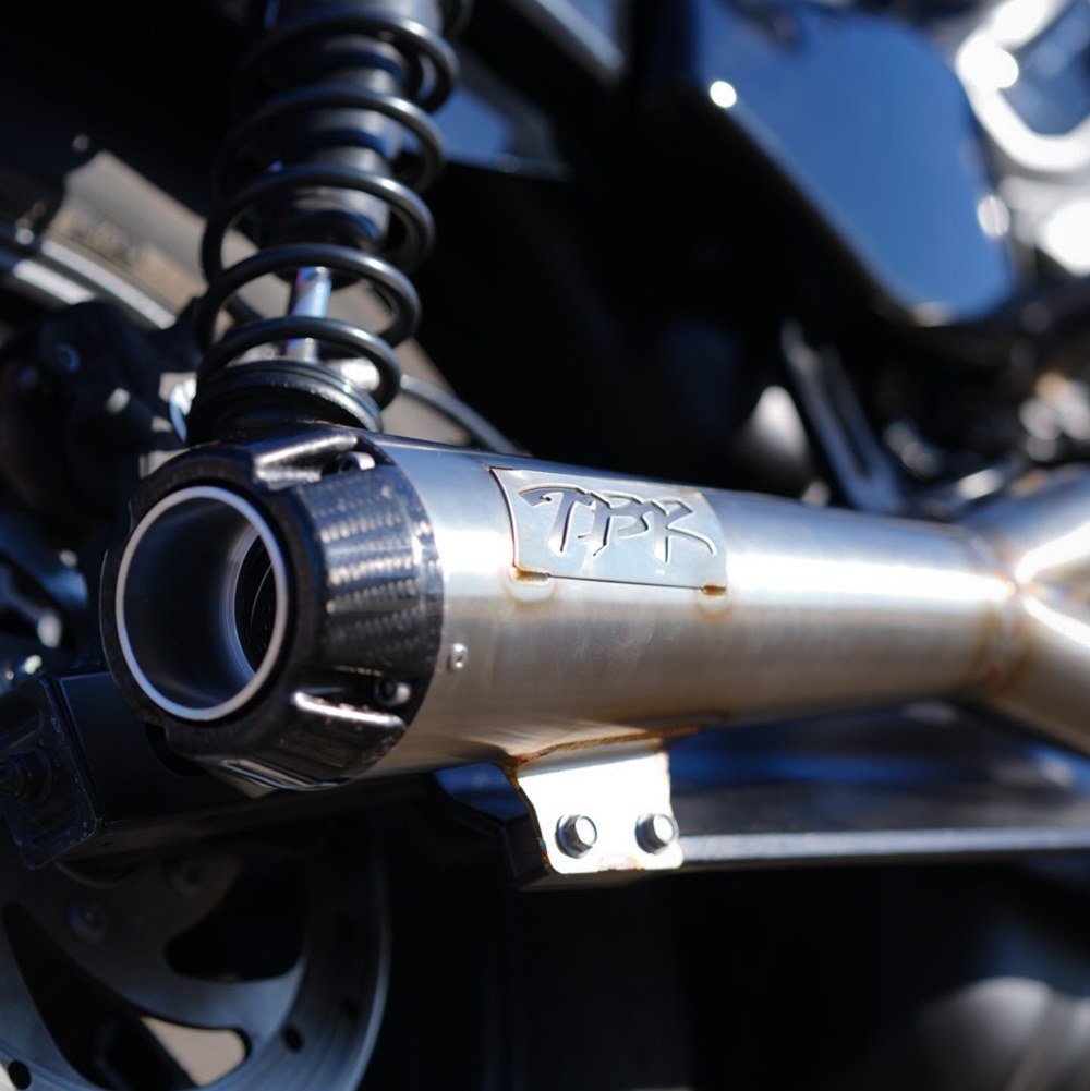 A close up of a motorcycle exhaust pipe featuring the Two Brothers Comp S stainless 2 into 1 exhaust for Harley Nightster RH975 2022-UP, showcasing high-quality materials and TIG welding.