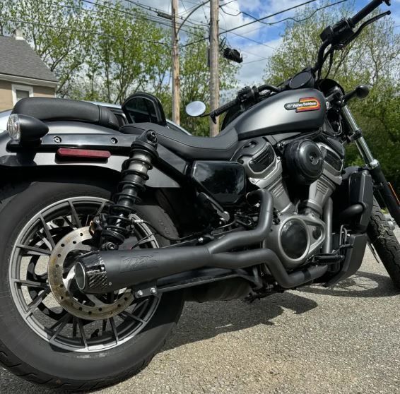 A black Two Brothers Comp S Black 2 into 1 Exhaust for Harley Nightster RH975 2022-UP on a white background.