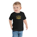 Toddler wearing a TC Bros. Winged Wheel Black/Gold cotton t-shirt, paired with jeans.