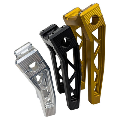 The TC Bros. Pro Series Pullback Truss Risers for Harley models by TC Bros. are CNC-machined, anodized metal handlebar risers available in gold, black, and silver. They feature a geometric design with visible bolts, perfect for Harley Davidson enthusiasts.