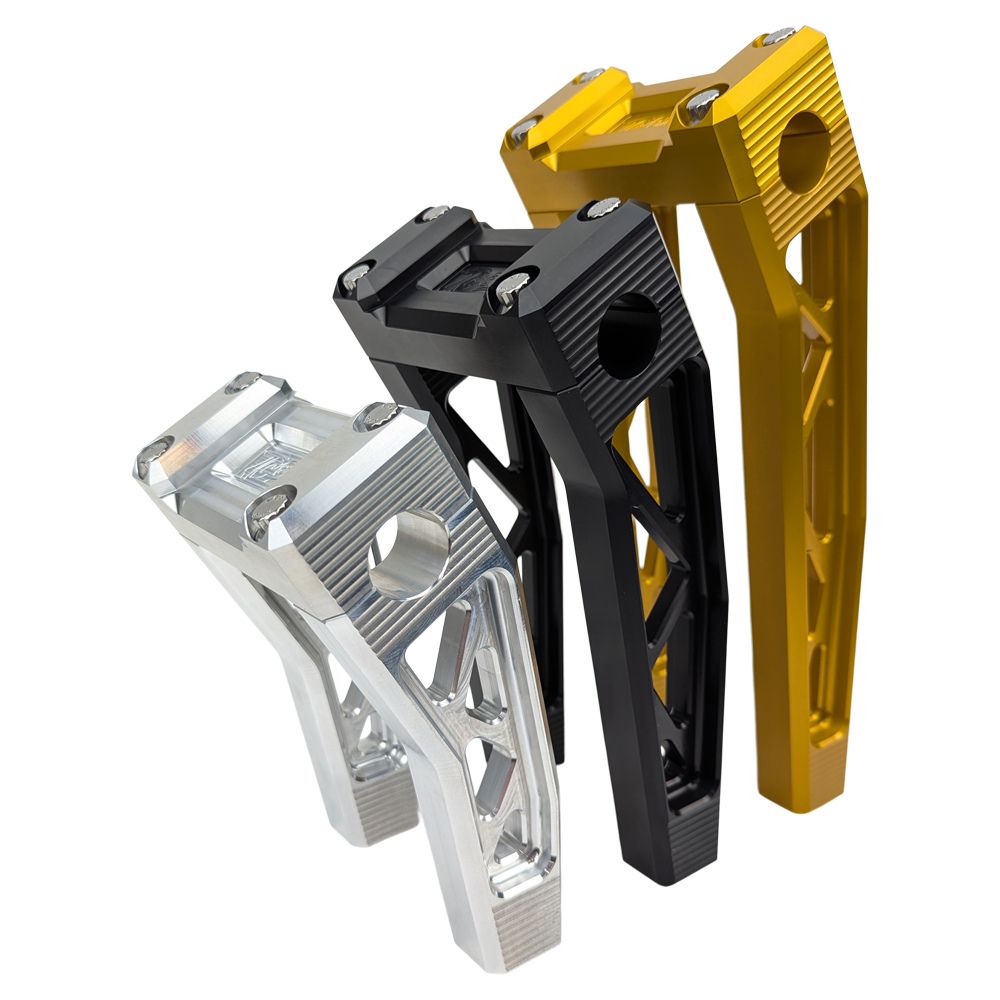 The TC Bros. Pro Series Pullback Truss Risers for Harley models by TC Bros. are CNC-machined, anodized metal handlebar risers available in gold, black, and silver. They feature a geometric design with visible bolts, perfect for Harley Davidson enthusiasts.