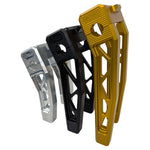 Three TC Bros. Pro Series Truss Digital Gauge Pullback Risers for Harley-Davidson Softail (2018-2024) in gold, black, and silver are upright against a white background, showcasing their durable style.