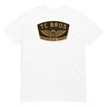 Winged Wheel - White Tee - (Front/Back Print), crafted from ring-spun cotton, featuring a small "TC Bros" logo on the left chest area.