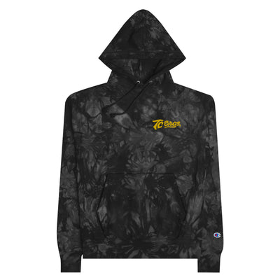 A black and gray camouflage patterned TC Bros. tie-dye hoodie with a yellow logo on the left chest.