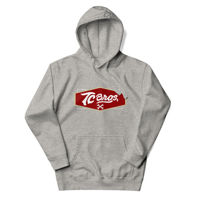 Carbon Gray TC Bros. Shield Hoodie with a red and white "tecos" logo on the front.