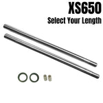 The TC Bros. Fork Tube Kit for Yamaha XS650 1977-1984 includes two metal rods, two green O-rings, and two white cylindrical parts on a white background with "XS650 Select Your Length"—ideal for your front end suspension upgrade.