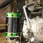 A close-up of a TC Bros. Chopper motorcycle with a chain on it.