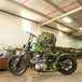 A TC Bros. motorcycle parked in a garage.