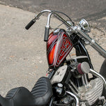 A TC Bros. Finned Raw Air Cleaner HD CV Carbs & EFI parked on the side of the road.