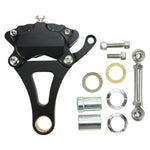 The Moto Iron® Left Side Springer Brake Caliper Kit - Black features a 4-piston caliper, bracket, arm, bolts, washers, spacers, and an adjustable rod—ideal for your Moto Iron Springer Brake setup. Laid out on a white background.