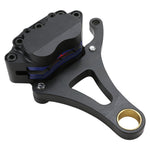 An image of a black brake pedal with Moto Iron's Springer Front End Brake Caliper Kit Right Side Black and a blue ring.