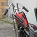 Moto Iron® 2.1 Gallon Narrow Sportster Frisco-style Fuel Tank, unpainted metal with open fuel cap, shown on a white background—ideal for chopper and custom bike fans.
