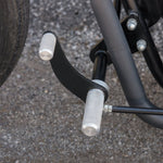 A close up of a TC Bros. Yamaha XS650 Forward Controls Kit motorcycle's handlebars and foot pegs, with custom choppers and forward controls kit.