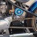 A motorcycle with a TC Bros. Electronics Tank (fake oil tank) attached to it.