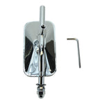 A chrome skateboard truck with an attached riser glistens like Moto Iron's Rectangular Mirror, accompanied by an Allen wrench on a pristine white background.