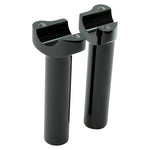 Two Moto Iron® 5.5" Black Forged Handlebar Risers for Harley, each a metal cylinder with threaded screw holes on top, stand vertically on a white background.