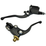 The Moto Iron® 1" Handlebar Control Kit includes black master cylinder and clutch levers with adjustment screws and a brass fitting, designed for Harley and custom bikes, shown on a white background.