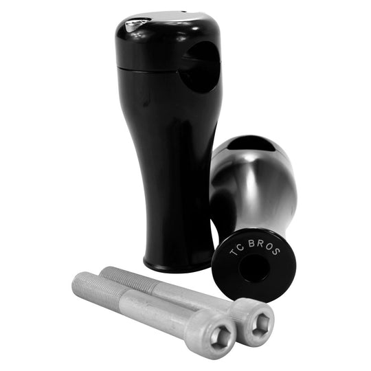 A pair of TC Bros. 4" Black Springer Risers for 1" Diameter Handlebars with a screw and bolt, CNC machined.