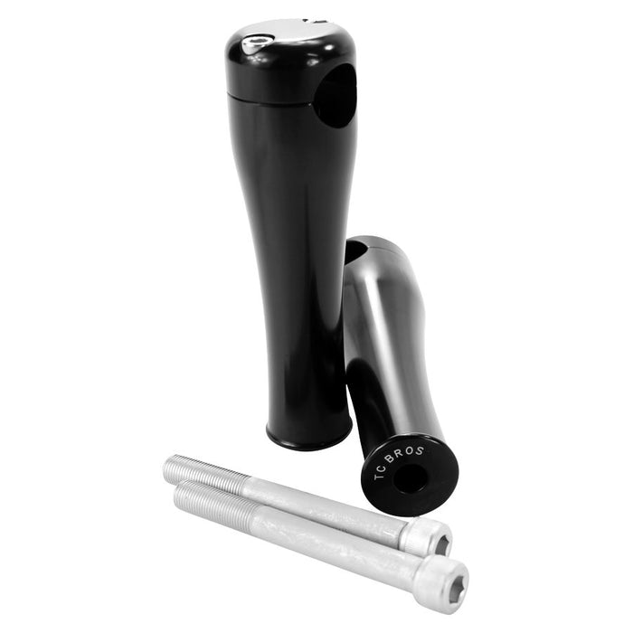 A pair of TC Bros. 6" Black Springer Risers for 1" Diameter Handlebars handlebar grips and a pair of screws.