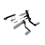 The TC Bros. Mid Controls Kit for 1991-2003 Harley-Davidson Sportster features metal foot pegs and a gear shift lever, perfect for upgrading your bike. Components are arranged on a white background.