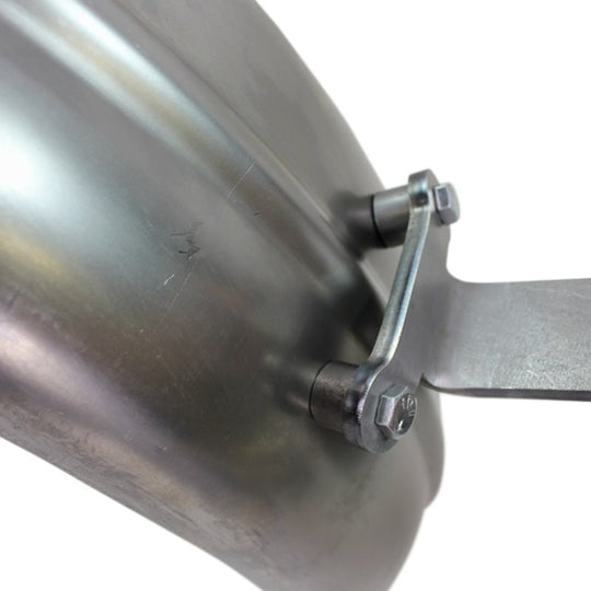 A close up of a Weld On Rear Ribbed Fender Mount for Bobbers & Choppers by TC Bros. with a metal handle featuring vintage style curves and contours.