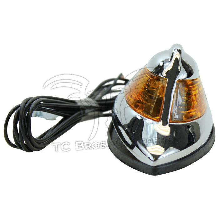 The Mid-USA Chrome Fender Lamp features a chrome-plated housing, amber lens, black wires, and dual mounting bolts—perfect for Harley-Davidson Springer models. Brand: Mid-USA.