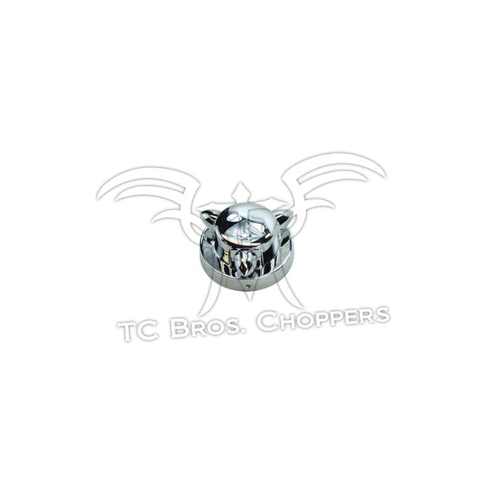 A shiny, chrome-plated Mid-USA Kromett Fuel Cap Cover for Harley-Davidson Big Twin and Sportster 1973-1981 with three pointed spikes is displayed against a white background.