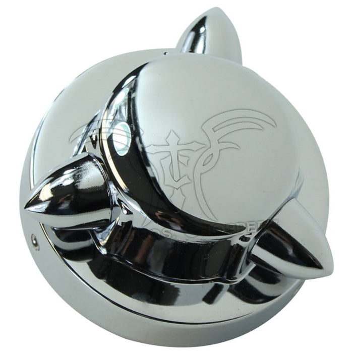 A shiny, chrome-plated Mid-USA Kromett Fuel Cap Cover for Harley-Davidson Big Twin and Sportster 1973-1981 with three pointed spikes is displayed against a white background.