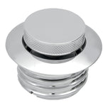 A close-up of the Moto Iron® Pop-Up Gas Cap - Vented - Chrome, featuring a circular, flat top and threaded base with a sleek, modern design.