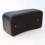 A Corbin Gentry Pillion Pad Passenger Seat sits on a white surface.