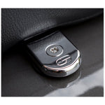 A black metal Saddlemen ATAB Security Seat Screw, a key ring with a Torx driver, and a matching Torx security screw—components of an anti-theft seat kit for 1997-up Harley-Davidson motorcycles—are displayed on a white background. This locking fastener is designed by Saddlemen to enhance seat security on your Harley-Davidson.