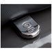 A close up of a car key with a Saddlemen - ATAB Security Seat Screw - Chrome on it, providing security.