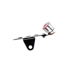 A small TC Bros. Cat Eye Side Mount Tail Light/License Plate Bracket with a red light attached to it, side mount license plate.