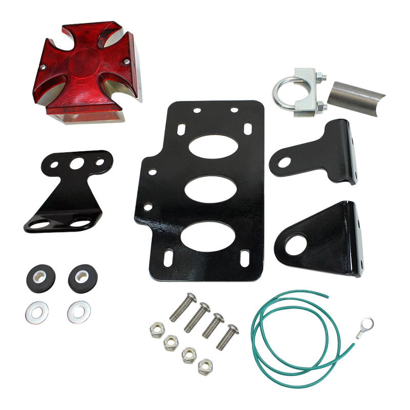 A set of versatile parts for a red motorcycle, including a TC Bros. Maltese Cross Side Mount Tail Light/License Plate Bracket and tail light.