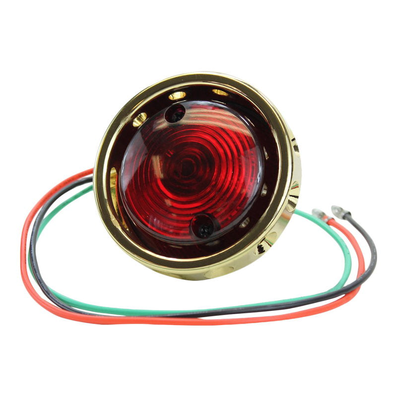 A red Mid-USA Brass Vintage Drilled Tail Light with red wires.