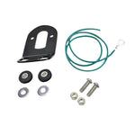 The TC Bros. Tail Light Bracket Conversion Kit includes a metal license plate bracket, green wire with ring terminal, two black rubber grommets, washers, bolts, and nuts—all from TC Bros.—arranged on a white background.