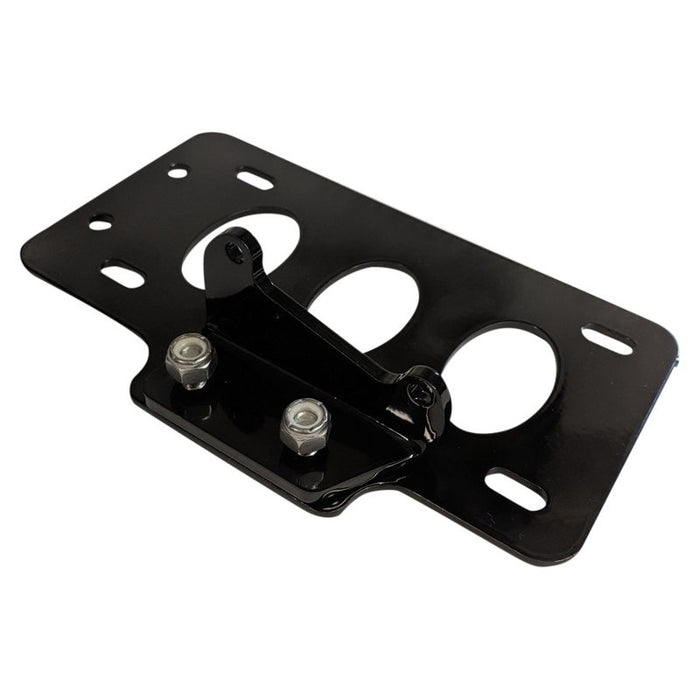 A TC Bros. metal plate with two holes on it, suitable for mounting a TC Bros. Side Mount License Plate Bracket (with no light) &